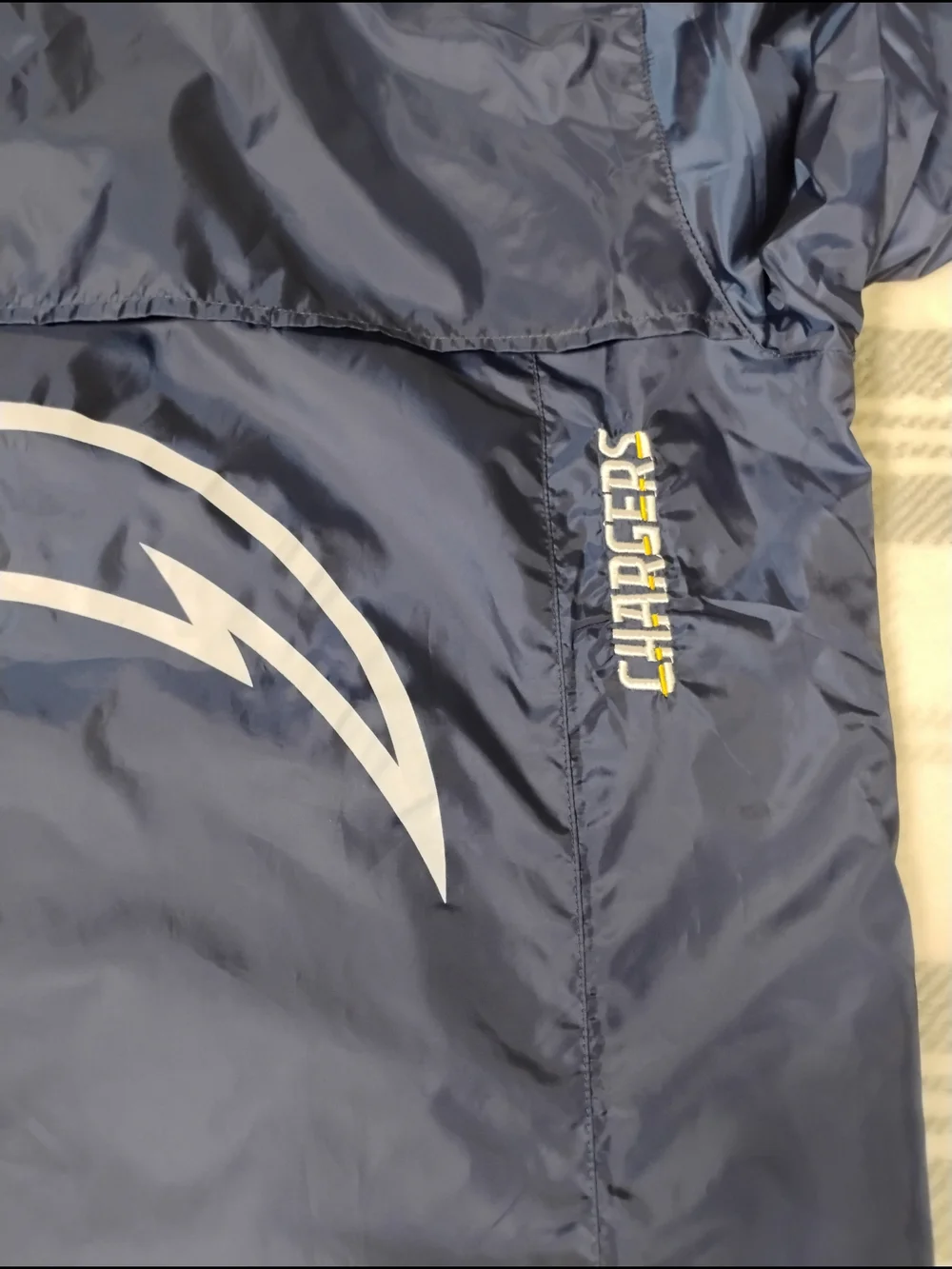 NFL Black Jacket with Red and Blue Shield Logo